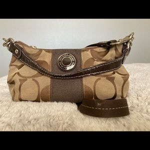 Coach canvas handbag. Zipper Closure. 6 1/2 inches high; 11 inches wide.